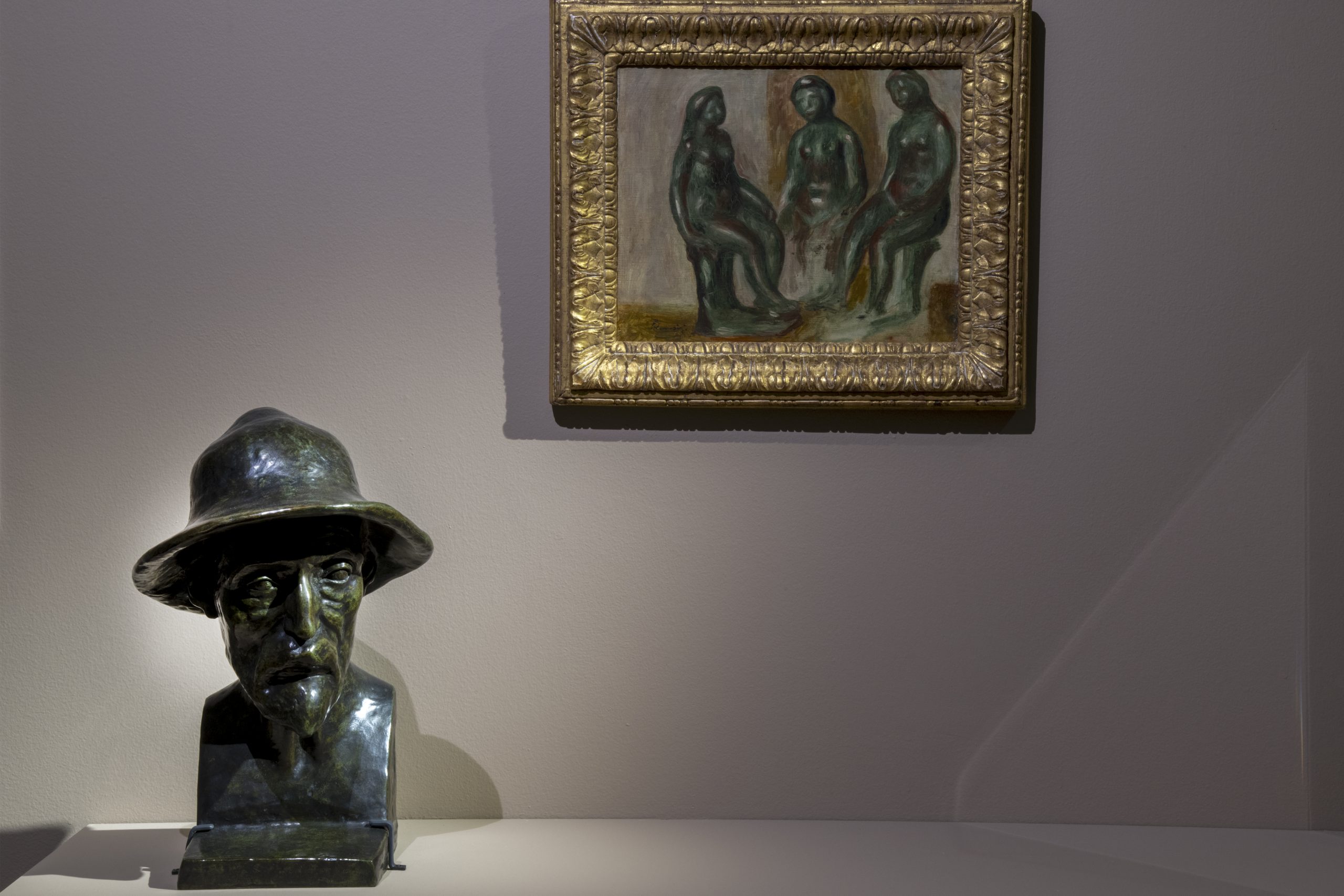 Vue du buste de Renoir et d'un tableau de Renoir représentant trois statuettes de Maillol